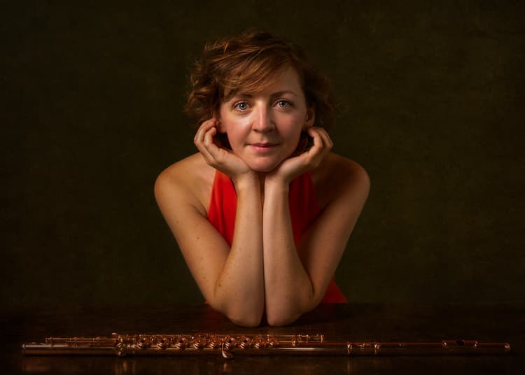 Fiona close up at table with flute